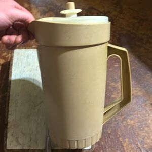 Vintage Tupperware Pitcher 2 quarts with push top lid and tan in color